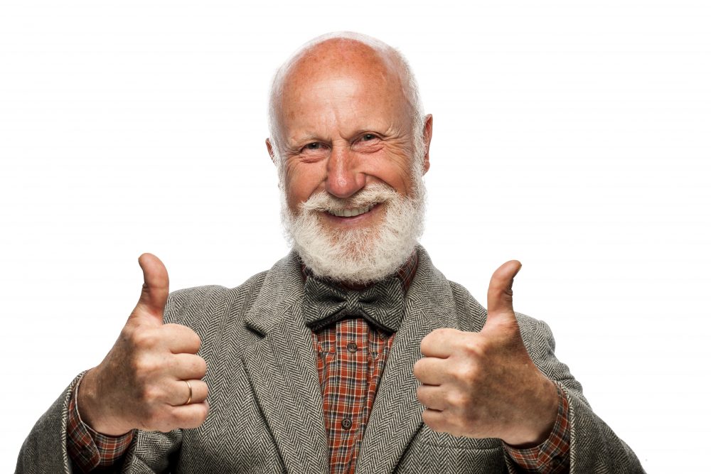 Old man with a big beard and a smile on white background