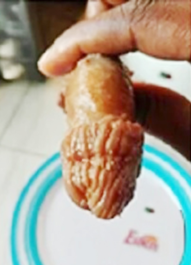 Pic shows: The served meat with the appearance of a male genital organ.nnAstonishing images of what looks like a human penis served up at a fast food bar have become a social media mystery.nnThe manhood-like dish had been unwittingly bought from a traditional chop house in Accra, Ghana by a customer named only as Akosua in local media.nnBut it was only when she got it home and started eating the dish - a local delicacy called Tuo Zafi ¿ that she realised she had bitten off more than she could chew.nnAkousa told local media: "I had gone to get some food from the food joint because I was hungry and my preferred choice was Tuo zafi which I bought and took home to eat."nnBut she did not spot the penis-shaped meat until she had gobbled down about 70 percent of the dish, she said.nnInitial tests at a laboratory proved inconclusive, explained Akosua, who was then urged to hand the meat to police for a full forensic examination.nnShe said: "My sister opted to show it to a lab technician friend later, who said because the meat was cooked, an ordinary lab test wouldn¿t be able to prove it to be animal or human."nnAkousa added: "He advised a forensic test be done on it and the meat lies in our fridge."nn(ends)