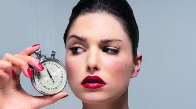 Woman holding watch