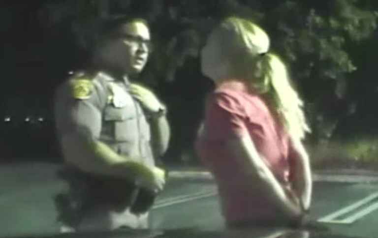 Drunk Woman Tries To Distract Police Officer In The Dumbest Way Possible (VIDEO)