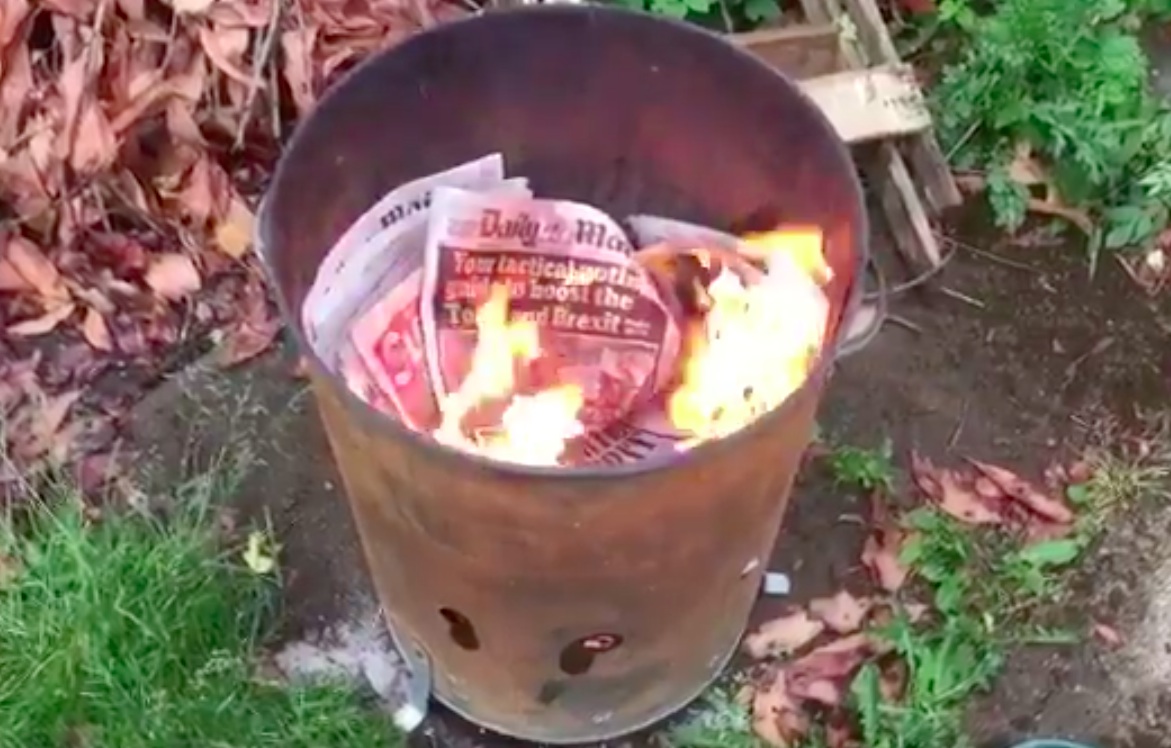 Burning newspapers