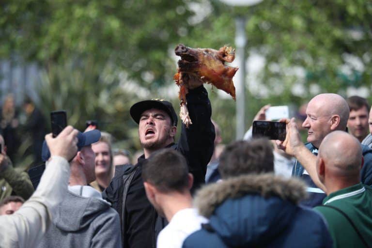 Barbaric Far Right Protestor Bites Chunks Out Of Pig’s Head During ‘Nasty’ EDL Hate Rally