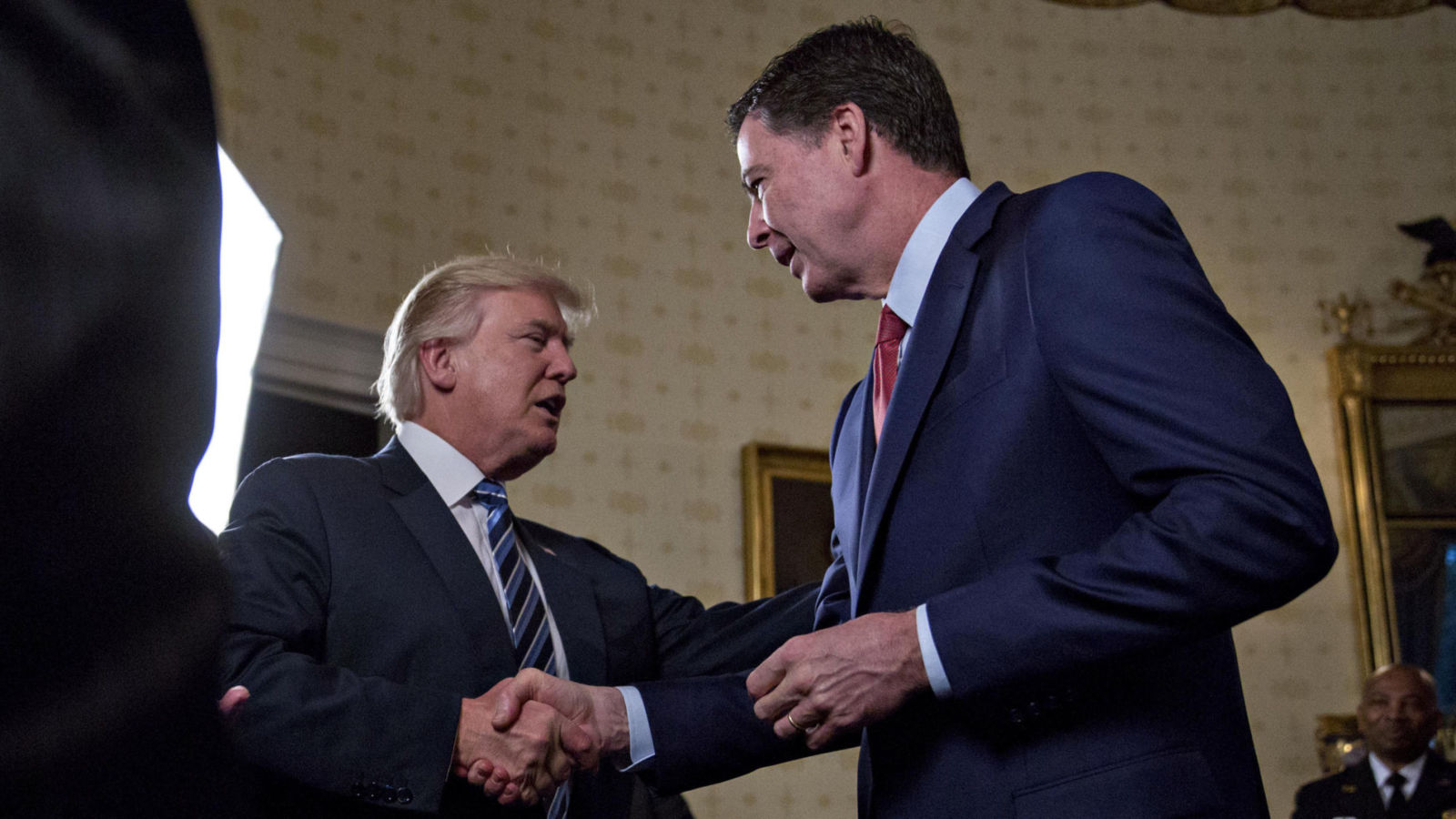 trum comey handshake