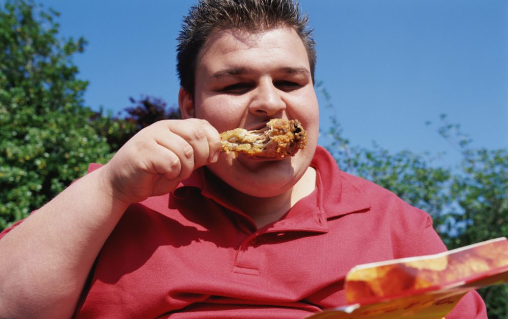 Man eating fried chicken