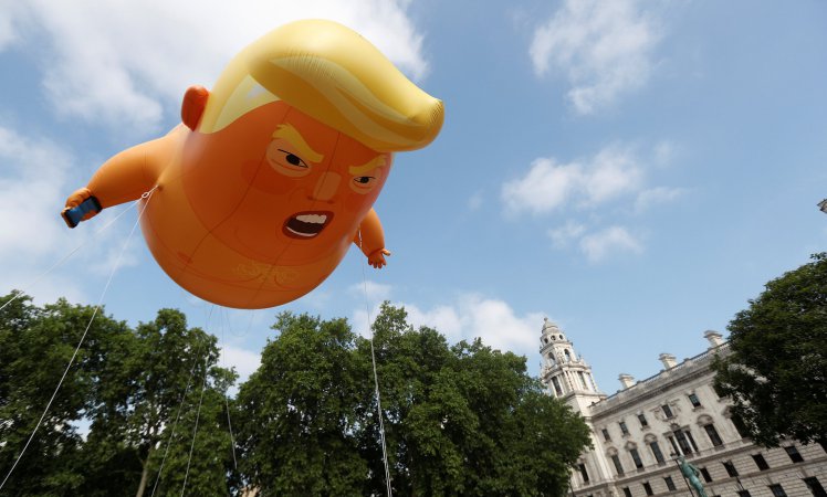 Demonstrators float a blimp portraying U.S. President Donald Trump, in Parliament Square, during the visit by Trump and First Lady Melania Trump in London