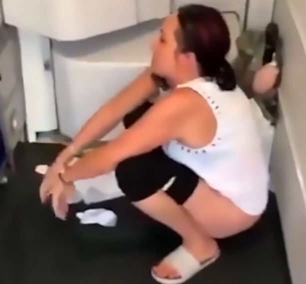 Woman Peeing On Floor