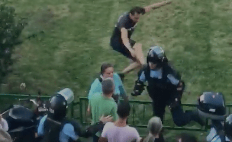 Anti-Government Protester With Balls Of Steel Fly-Kicks Police Officer Into Oblivion (VIDEO)