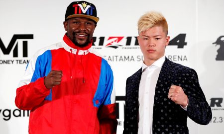 Boxer Floyd Mayweather Jr. of the U.S. poses for a photograph with his opponent Tenshin Nasukawa during a news conference in Tokyo