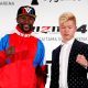 Boxer Floyd Mayweather Jr. of the U.S. poses for a photograph with his opponent Tenshin Nasukawa during a news conference in Tokyo