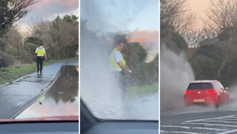 Police Officer Gets Completely Drenched By Giggling Man Driving Through Puddle (VIDEO)