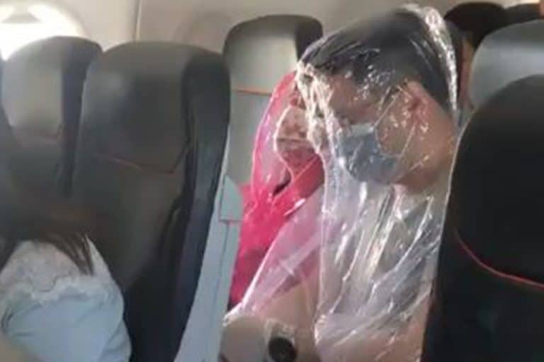 Worried Air Passengers Are Wrapping Themselves In Full-Body Plastic Sheets To Fend Off Coronavirus