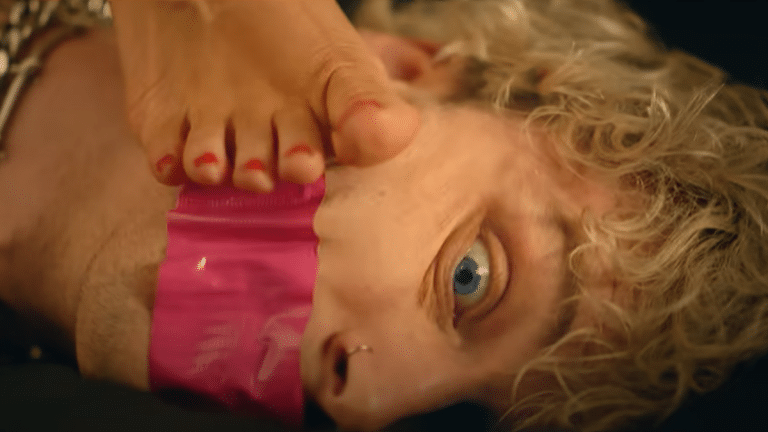 Machine Gun Kelly Says Megan Fox Has ‘The Most Beautiful Feet To Ever Exist’ After She Steps On His Face For Music Video