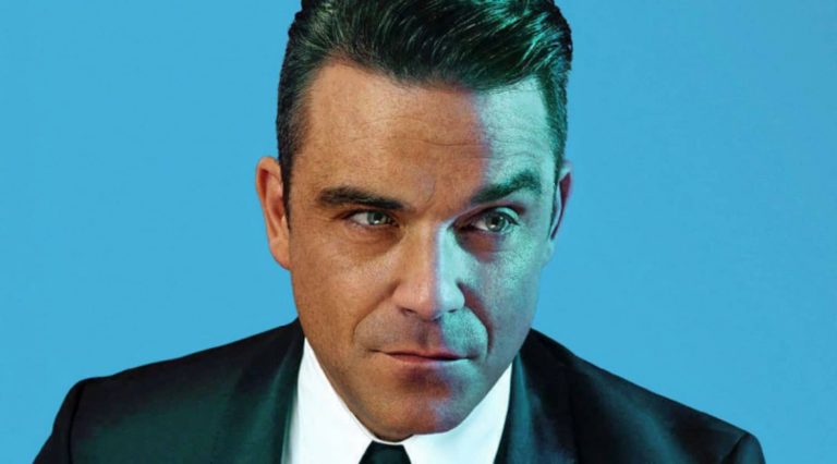 Robbie Williams Confesses He Once Pooped In His Own Hand On A Flight Whilst Trying To Secretly Fart