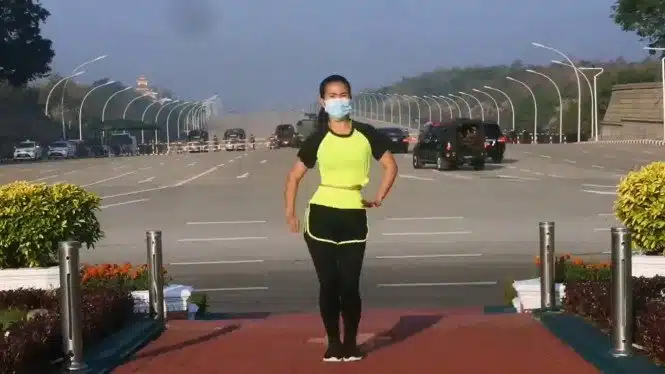 A Woman Performed A Dance Aerobics Routine With The Myanmar Coup Going On Behind Her
