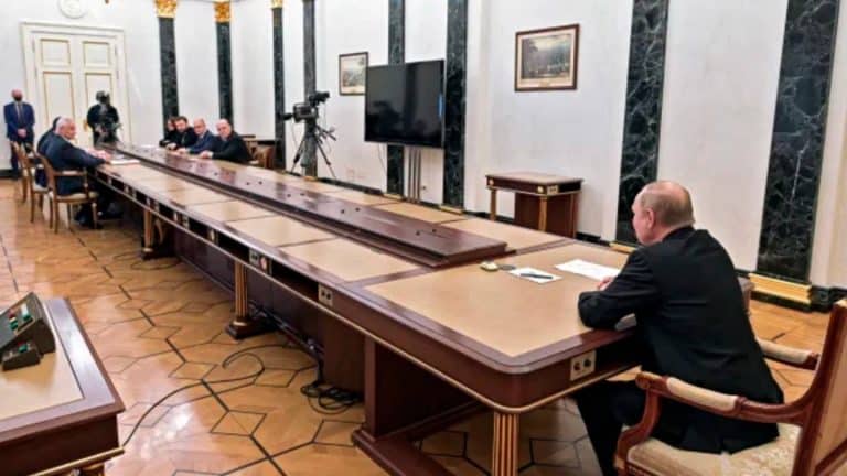 Former Soviet Union Soldier Explains Why Putin Was Pictured Sitting At The End Of Long Table