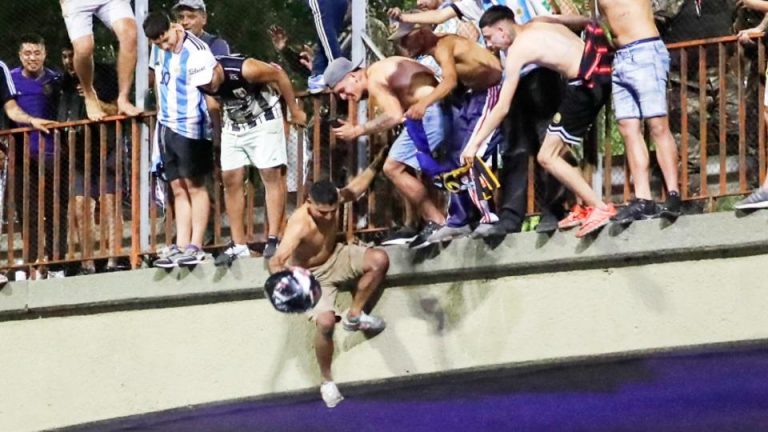 Watch Argentinian Fans Jump Off A Bridge Onto Open Top Bus Parade