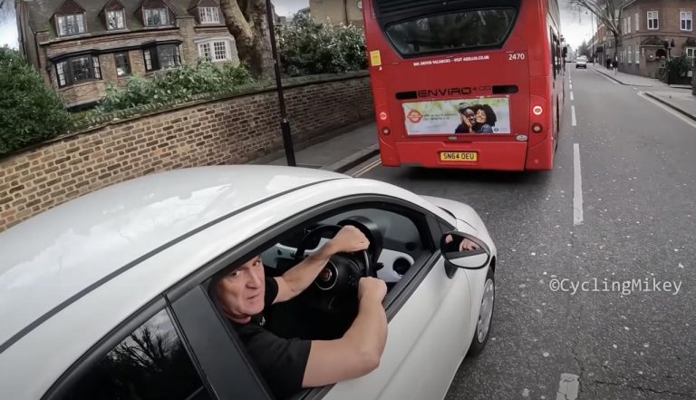 Driver Caught Using Phone Launches Hilarious Foul-Mouthed Rant At ‘Virgin’ Cyclist (VIDEO)