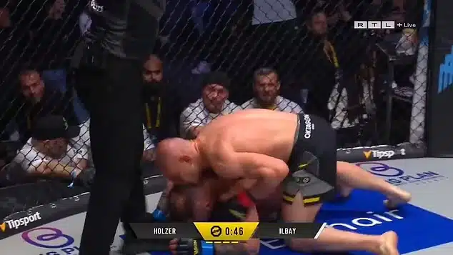 MMA Fighter Gets Punched Out Of Cage After He Kissed And Humped His Opponent